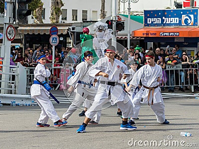 Participants of the Karate section show their skills at the carnival of Adloyada in Nahariyya, Israel Editorial Stock Photo