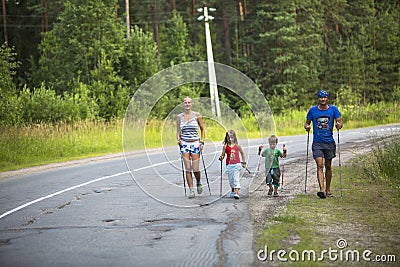 Participants (kids: Nikolay Dubinin /4, Darja Zhochkina /6) during of competitions in Nordic walking devoted to the Day of Editorial Stock Photo