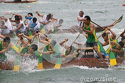 Participants paddle their dragon boats Editorial Stock Photo