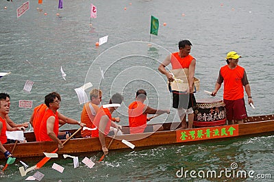 Participants paddle their dragon boats Editorial Stock Photo