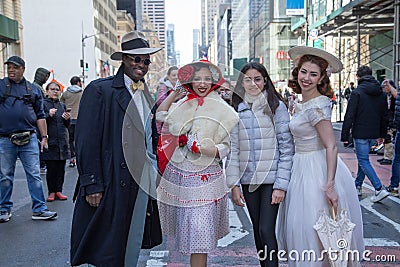 Participants pose with a spectator during Easter Bonnet Parade Editorial Stock Photo