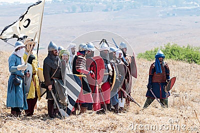 Participants in the reconstruction of Horns of Hattin battle in 1187 Dressed in the costumes of Saladin`s soldiers stand in antici Editorial Stock Photo