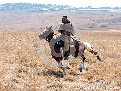 Participants in the reconstruction of Horns of Hattin battle in 1187 moving around the battlefield near Tiberias, Israel Editorial Stock Photo