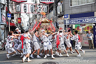 Participants of Tenjin Matsuri worships the golden shrine, July Editorial Stock Photo