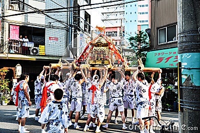 Participants of Tenjin Matsuri worships the golden shrine, July Editorial Stock Photo