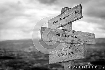 participation equals value text quote on wooden signpost Stock Photo