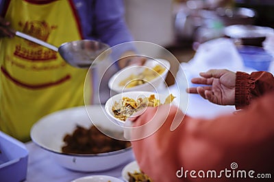 Participation in sharing food for the poor : the concept of food shortage in the world Editorial Stock Photo