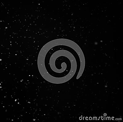 Particles of snow on a black background Stock Photo