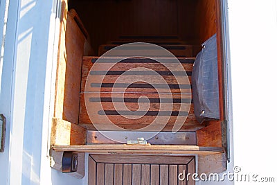 Particular of the ladder to access the undercover of a vintage sailboat Stock Photo