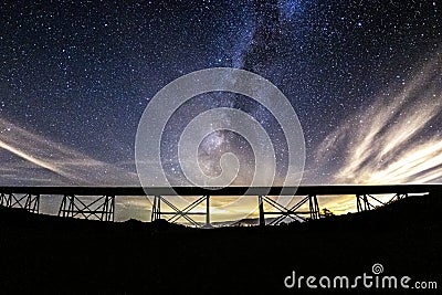 Partly Cloudy Milky Way Over the Abandoned Eagle Mountain Railroad EMRR Trestle. Stock Photo