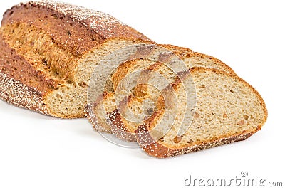 Partly sliced brown bread with whole sprouted wheat grains close Stock Photo