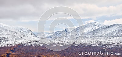 Partly snowy mountain area valley in Abisko National Park in, Sweden. Stock Photo