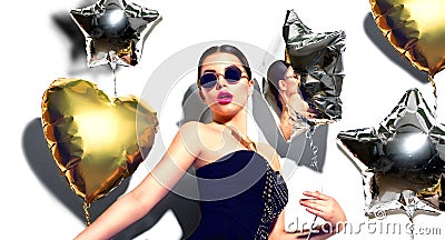 Party. Beauty model girl with colorful heart and star shaped balloons Stock Photo