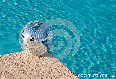 Party! Disco Ball beside resort swimming pool Stock Photo