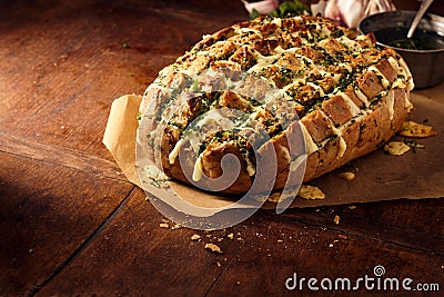 Party loaf dripping with melted cheese Stock Photo