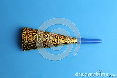 Party noisemaker isolated on blue background Stock Photo