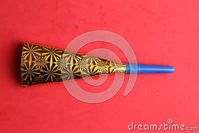 Party noisemaker isolated on a red background Stock Photo