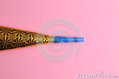 Party noisemaker on a pink background Stock Photo