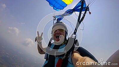 Party. People are floating in the air. The movements of parachutists resemble a dance in the clouds. Stock Photo