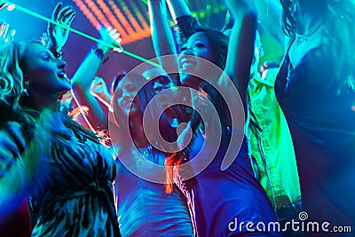 Party people dancing in disco or club Stock Photo