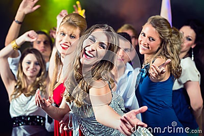 Party people dancing in disco club Stock Photo