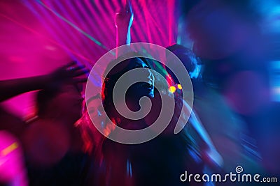 Party people dancing in disco or night club Stock Photo