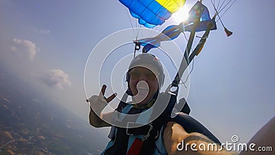 Party. People are floating in the air. The movements of parachutists resemble a dance in the clouds. Stock Photo