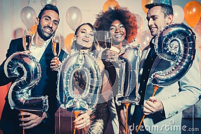 Party people women and men celebrating new years eve 2019 Stock Photo