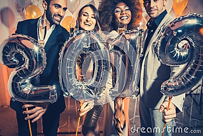 Party people women and men celebrating new years eve 2019 Stock Photo