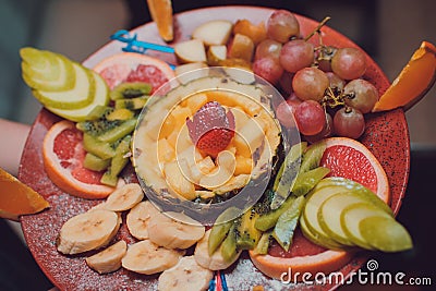 Party hors d `oeuvre platter of assorted cheeses and fruits from above Stock Photo