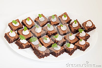 Party platter with small chocolate cakes Stock Photo