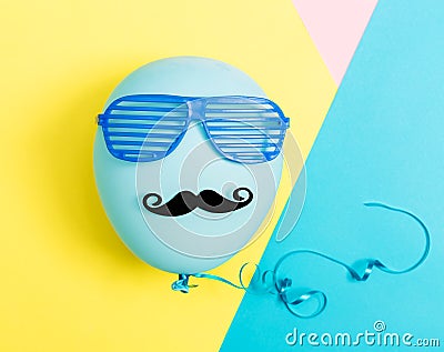 Party theme with balloon, moustache and shutter shades Stock Photo