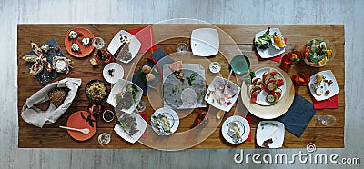 After party. Wasted food on wooden served festive table Stock Photo