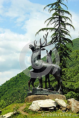 Pasanauri, Georgia - June 19, 2016: Roadside sculpture of a deer near the confluence of Black and White Aragvi rivers Editorial Stock Photo