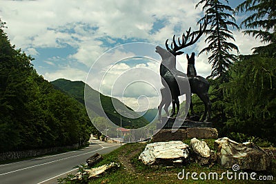 Pasanauri, Georgia - June 19, 2016: Roadside sculpture of deers near the confluence of Black and White Aragvi rivers Editorial Stock Photo