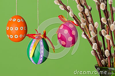 Paschal eggs on willow bouquet, horizontal over green Stock Photo