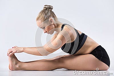 Paschimothanasana yoga pose Stock Photo