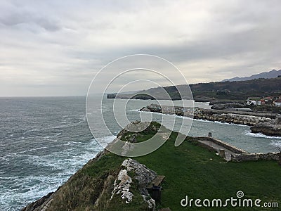 Paseo de San Pedro view from a cliff on a rainy day in March, Llanes, Principality of Asturias, in the north of Spain Stock Photo