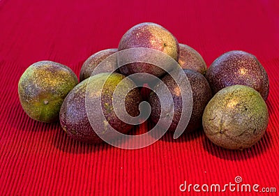 Pasiflora fruits on red cloth napkin Stock Photo