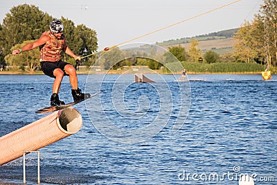 Rider wakeboarding in the cable wake park Merkur Editorial Stock Photo