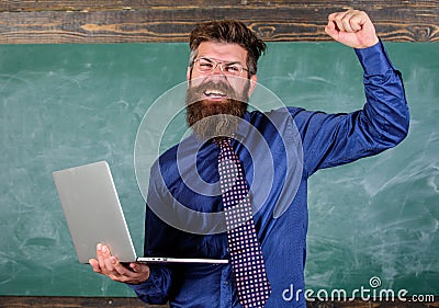 Pass test online. Distance education concept. Teacher bearded man with modern laptop passed test online chalkboard Stock Photo