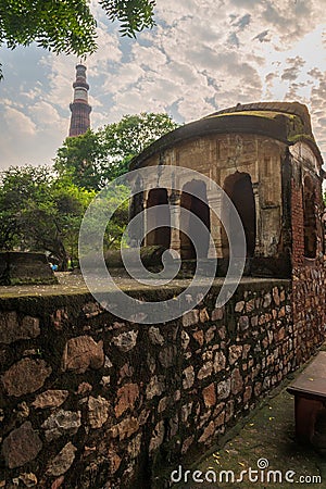 Qutub Minar and smaller building in the Qutub Minar Complex, Delhi, India Editorial Stock Photo
