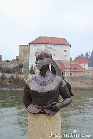 Bust of the poet and landlady Emerenz Meier on the quay of the Danube river in Passau, Germany. Editorial Stock Photo