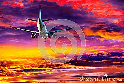 Passenger aircraft on colorful sky Stock Photo