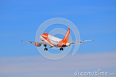 Passenger Aircraft With Undercarriage Down. New Easyjet Colours Editorial Stock Photo