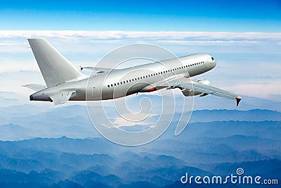 Passenger aircraft view from behind. The plane flies away. Stock Photo