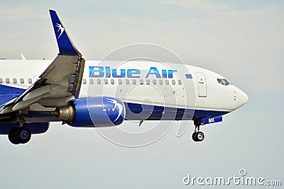 Passenger airplane Blue Air just before landing at the Chopin airport. Editorial Stock Photo