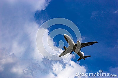 Passenger airplane in blue sky Stock Photo