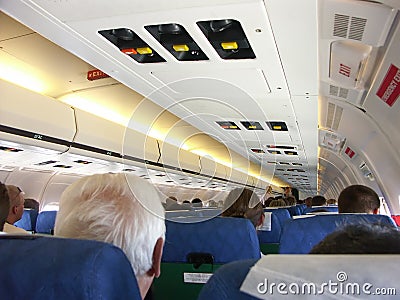 On passenger airplane board Stock Photo