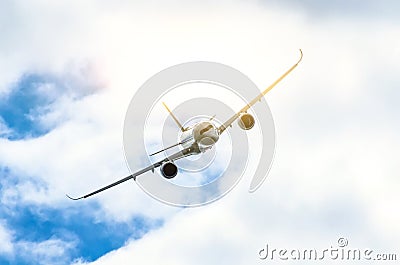 Passenger airplane flies through the turbulence zone through the lightning of storm clouds in bad weather. Stock Photo